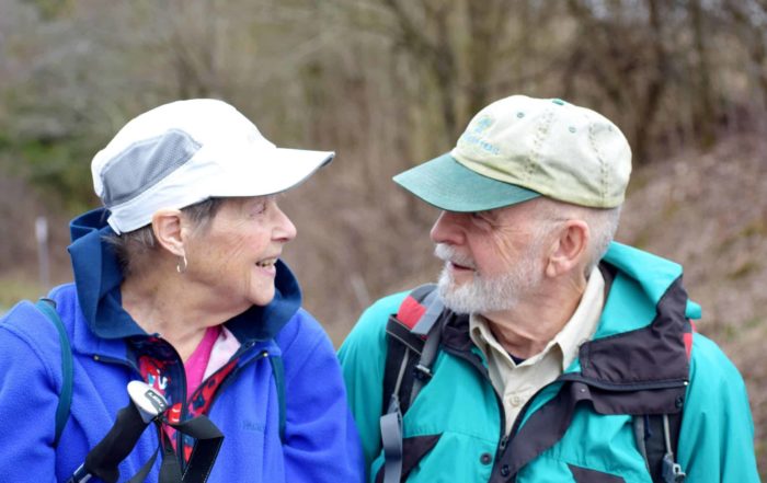 Image of an older couple hiking