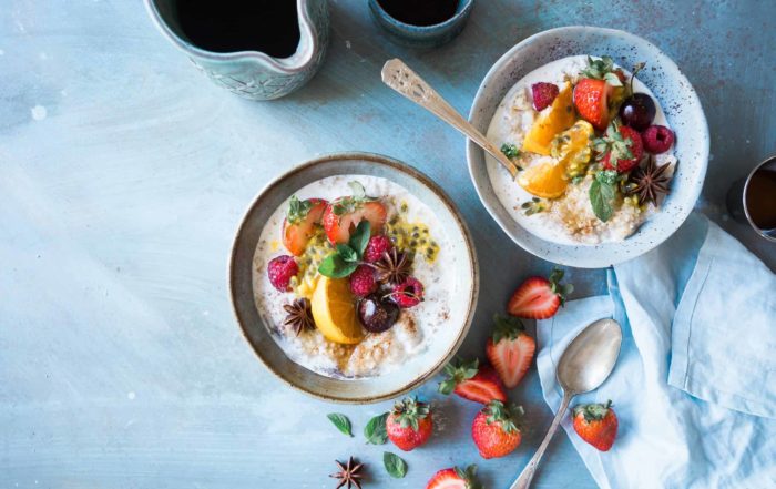 Image of bowls of oatmeal with fruit on top