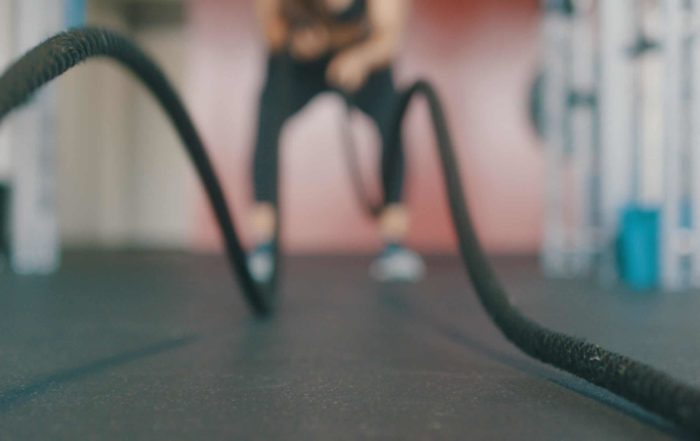 Image of someone working out using battle ropes