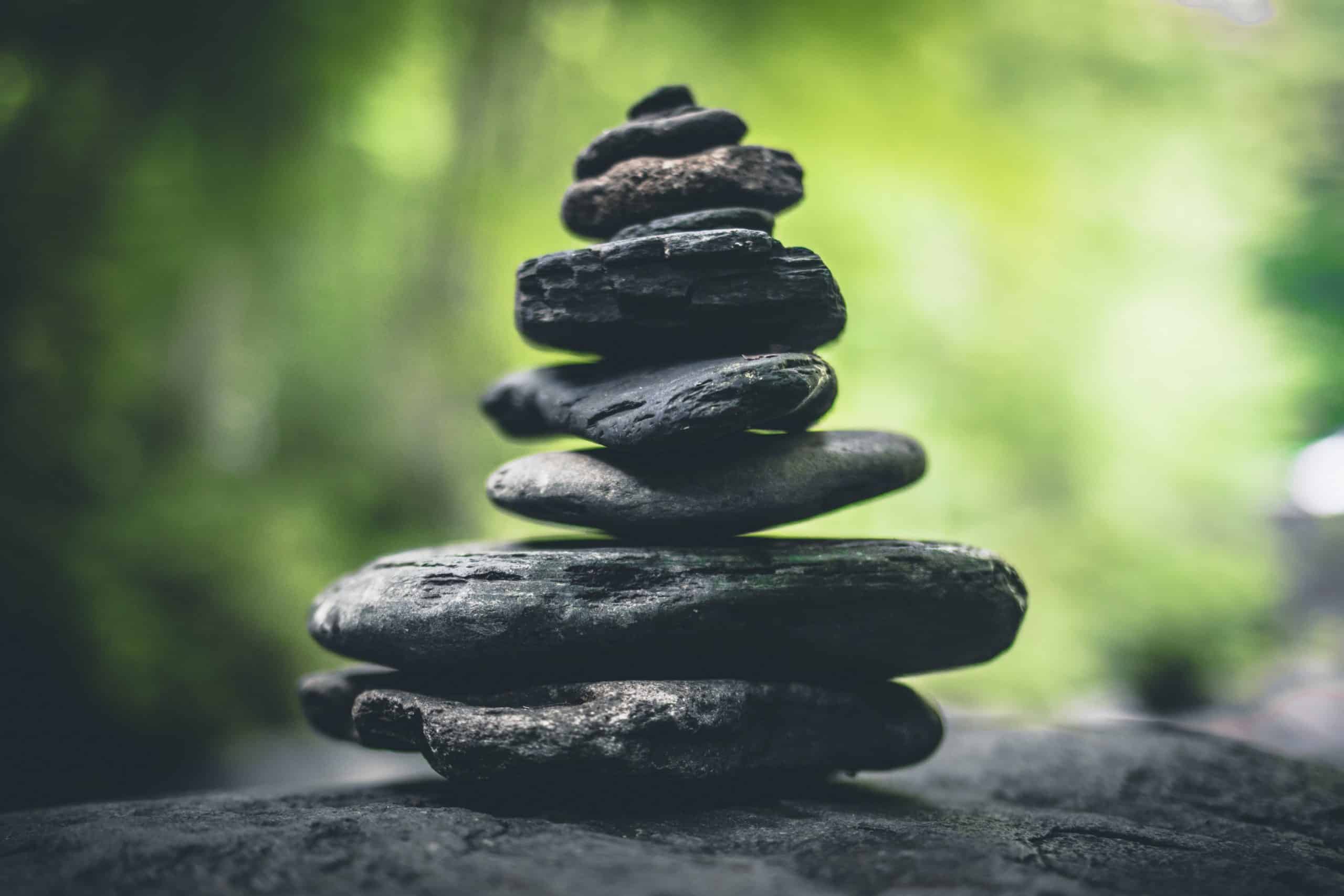 Image of stones stacked in a forest