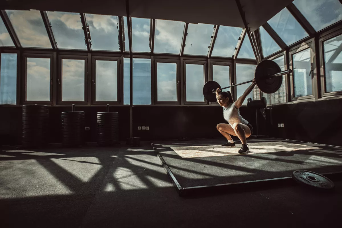 image of female exercising with a weighted barbell
