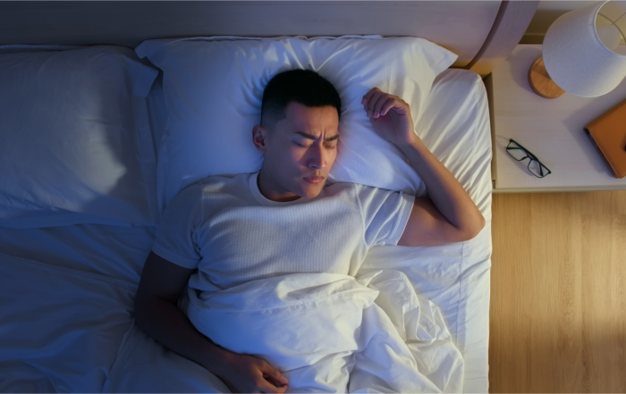 male sleeping in bed