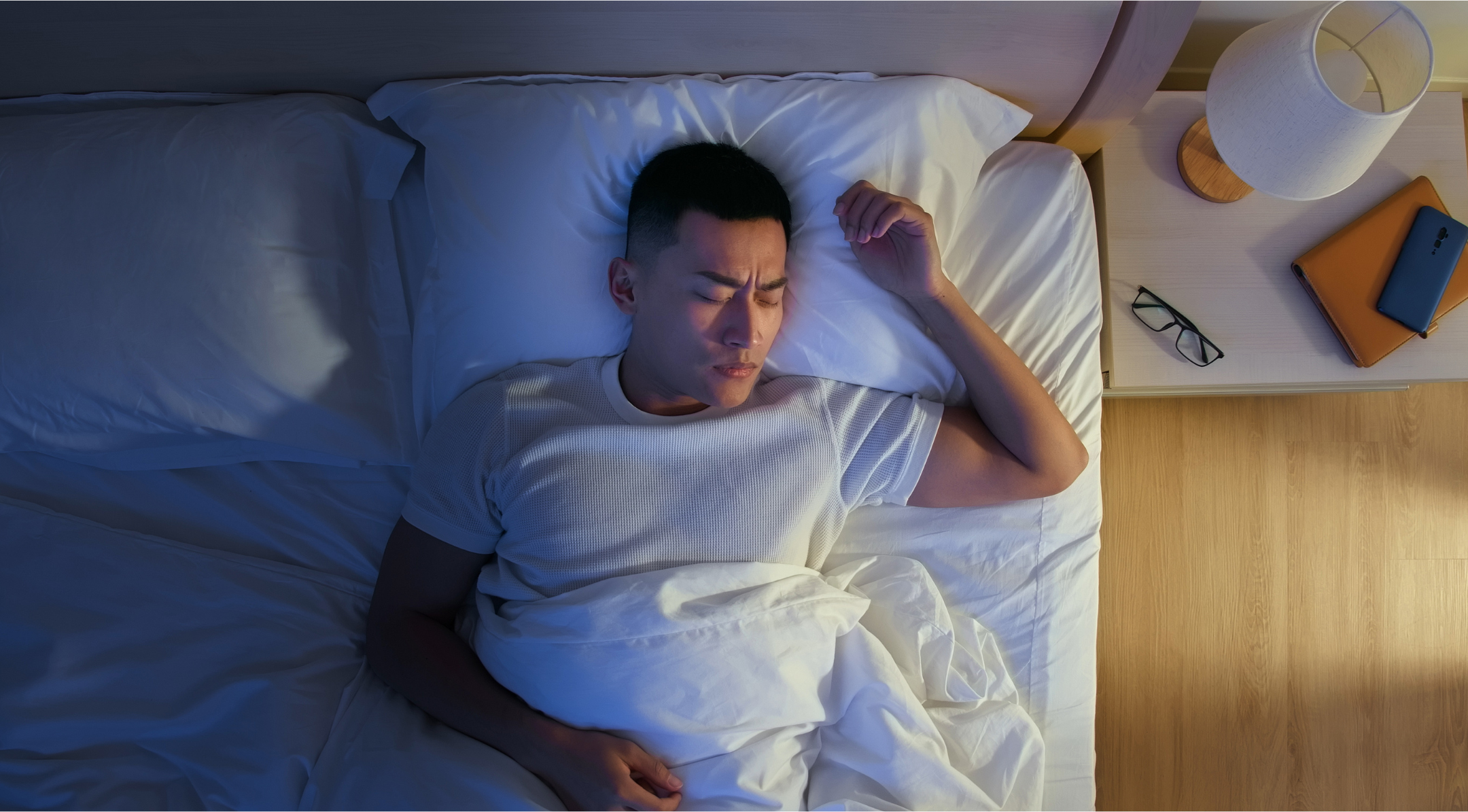 male sleeping in bed